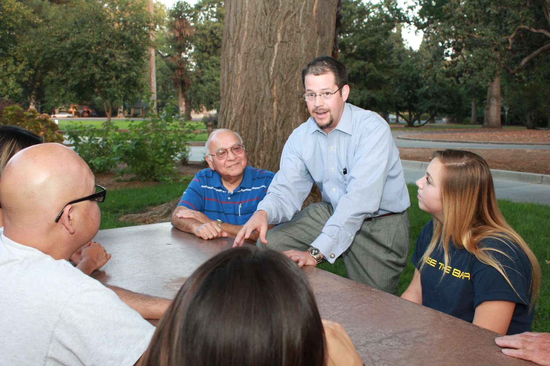 Randall Stone in close conversation with community members