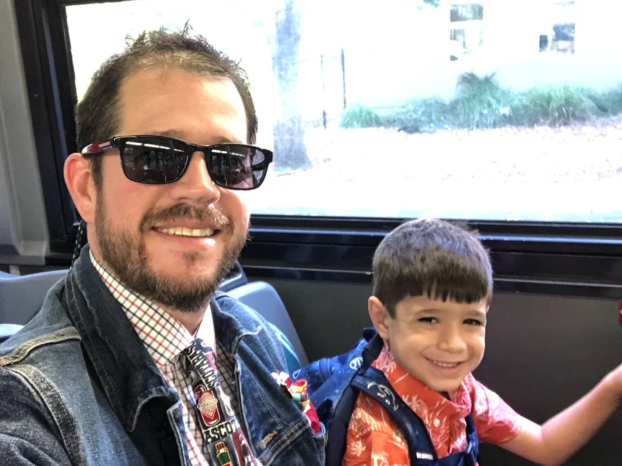 Randall Stone riding B-Line transit with one of his children