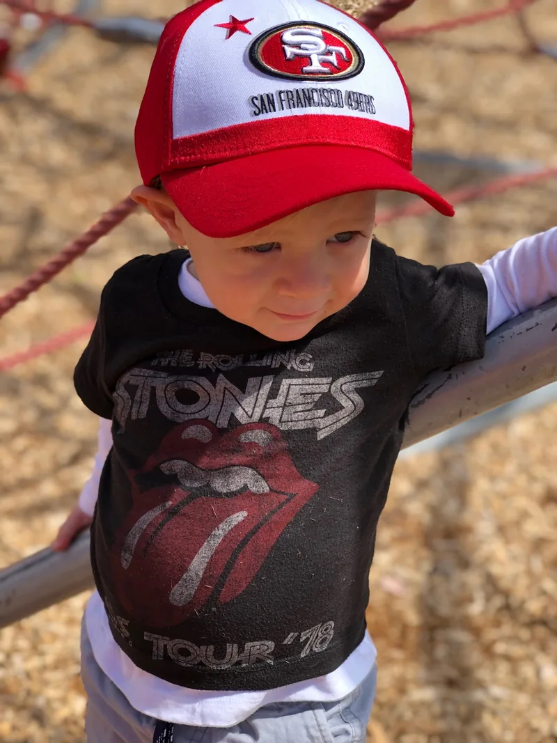 Karden Stone wearing a Rolling Stones shirt and San Francisco 49ers cap